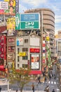 Corner of Shinjuku Rambling Road and KÃÂshÃÂ« KaidÃÂ route full of catchy advertising signs.